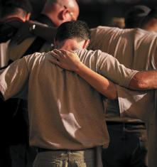 Men praying together